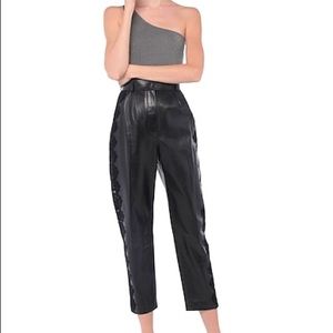 ALEXANDER MCQUEEN LEATHER PANTS WITH LACE.